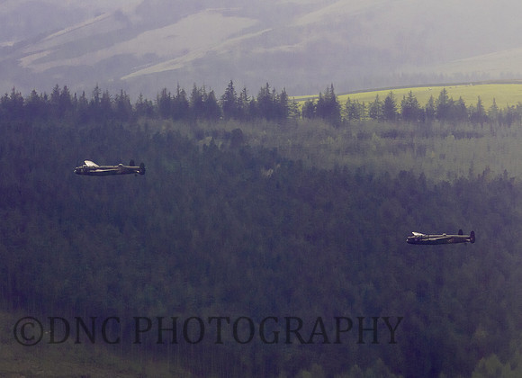 BBMF AVRO Lancaster (Mk I) PA474 City of Lincoln leads CWHM AVRO Lancaster (Mk X) FM213 VERA over Derwent Dam