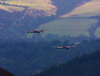 BBMF AVRO Lancaster (Mk I) PA474 City of Lincoln leads CWHM AVRO Lancaster (Mk X) FM213 VERA over Derwent Dam