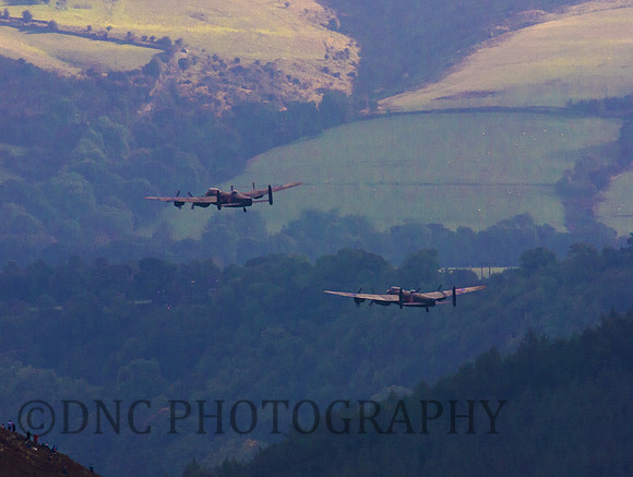BBMF AVRO Lancaster (Mk I) PA474 City of Lincoln leads CWHM AVRO Lancaster (Mk X) FM213 VERA over Derwent Dam