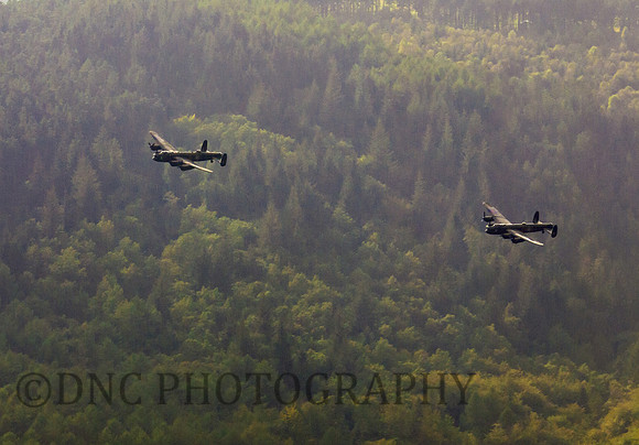 BBMF AVRO Lancaster (Mk I) PA474 City of Lincoln leads CWHM AVRO Lancaster (Mk X) FM213 VERA over Derwent Dam