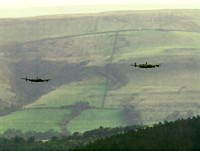 BBMF AVRO Lancaster (Mk I) PA474 City of Lincoln leads CWHM AVRO Lancaster (Mk X) FM213 VERA over Derwent Dam