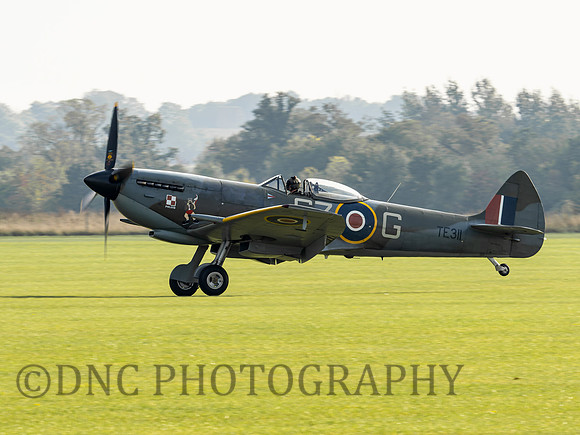 SQN LDR Mark (Disco) Discombe lands Spitfire MkXVI TE311 after his last display as OC BBMF