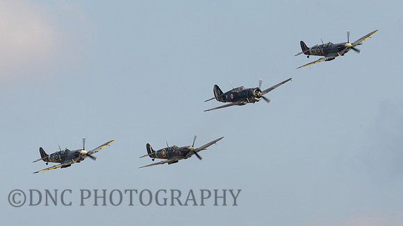 L-R Spitfire Mk Vb EP120 AE-A, Spitfire Mk Vb BM597 RF-M Curtiss Hawk 75 X881, Spitfire Mk Vc EE602 QV-V.