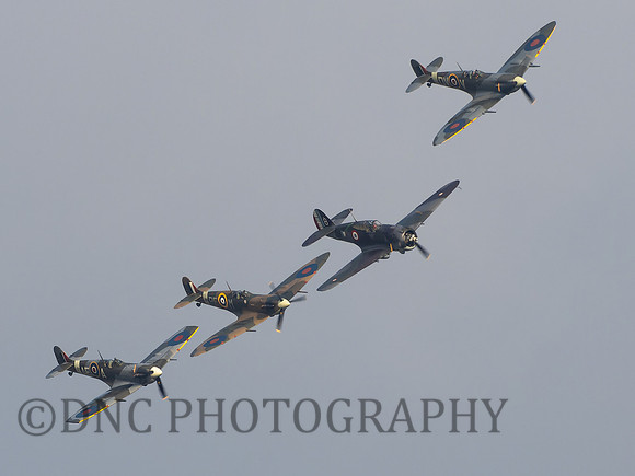 L-R Spitfire Mk Vb EP120 AE-A, Spitfire Mk Vb BM597 RF-M Curtiss Hawk 75 X881, Spitfire Mk Vc EE602 QV-V