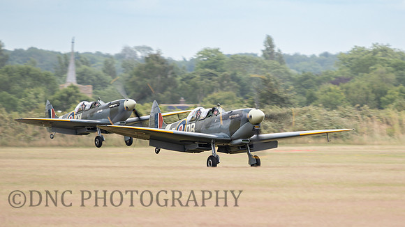 Supermarine Spitfire LFIXE NH341 lands in front of Spitfire MKIX MJ444 Lucky Lady