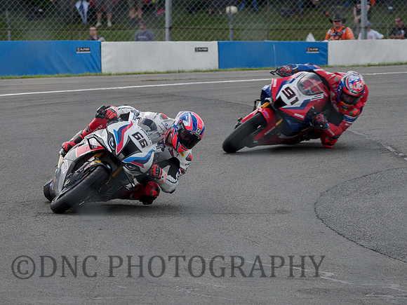 Tom Sykes BMW M1000RR leads Leon Haslam Honda CBR1000 RR-R