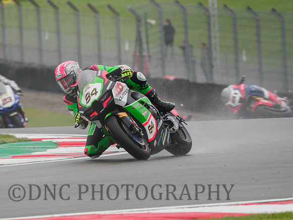 Loris Cresson Pedercini Kawasaki ZX-10RR as Leon Haslam crashes in the background