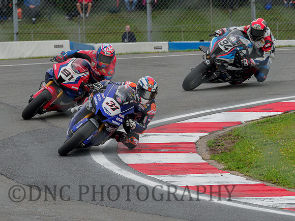 Garrett Gerloff GRT Yamaha YZ-F R1 leads Leon Haslam HRC Honda CBR1000 RR-R & Jonas Folger BMW M1000RR
