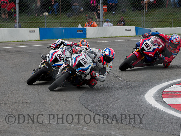 Tom Sykes BMW M1000RR leads Michael Van Der Mark BMW M1000RR & Leon Haslam Honda CBR1000 RR-R