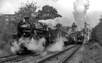 Black 5 45066 (45428) waits for LNER Q6 63395 leaves Goathland with the 09:31 from Grosmont