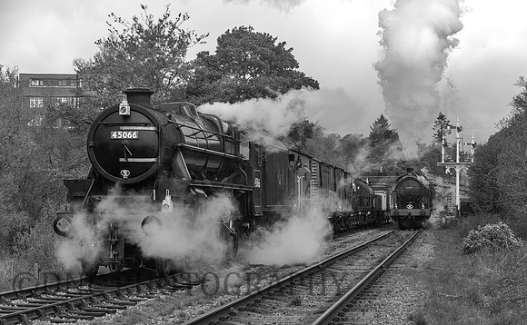 Black 5 45066 (45428) waits for LNER Q6 63395 leaves Goathland with the 09:31 from Grosmont