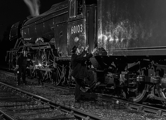 Crew prepare their engine.