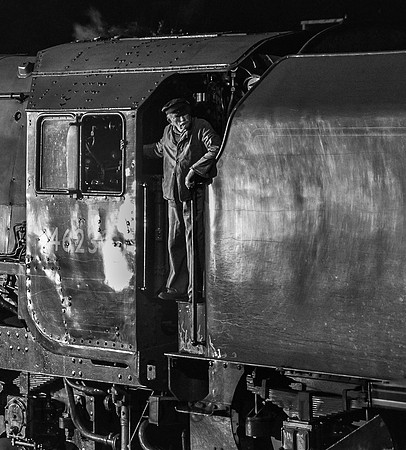 Driver on footplate of LMS Princess Coronation 46233 Duchess of Sutherland