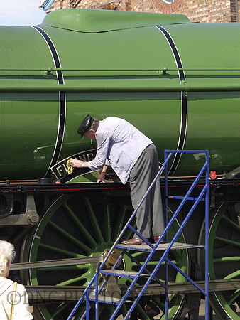 Cheif Engineer Rowland Kenington clean the name plate at Doncaster for Plant 150