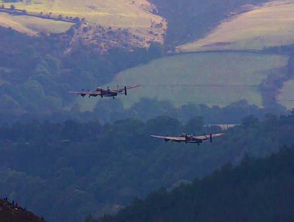 BBMF AVRO Lancaster (Mk I) PA474 City of Lincoln leads CWHM AVRO Lancaster (Mk X) FM213 VERA over Derwent Dam