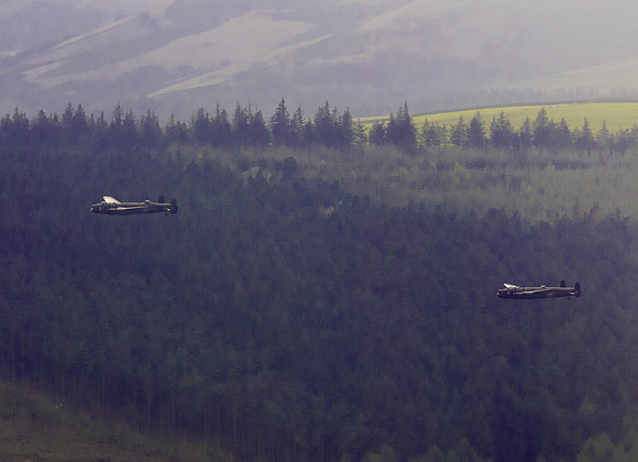 BBMF AVRO Lancaster (Mk I) PA474 City of Lincoln leads CWHM AVRO Lancaster (Mk X) FM213 VERA over Derwent Dam