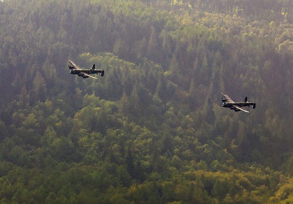 BBMF AVRO Lancaster (Mk I) PA474 City of Lincoln leads CWHM AVRO Lancaster (Mk X) FM213 VERA over Derwent Dam