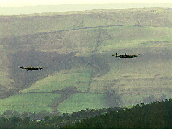 BBMF AVRO Lancaster (Mk I) PA474 City of Lincoln leads CWHM AVRO Lancaster (Mk X) FM213 VERA over Derwent Dam
