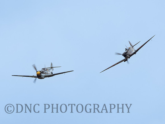 Hispano HA-1112-M1L Buchon 'Yellow 10' chased by Supermarine Spitfire MK.1A N3200 QV .1