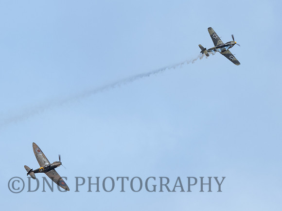 Hispano HA-1112-M1L Buchon 'Yellow 10' chased by Supermarine Spitfire MK.1A N3200 QV .2