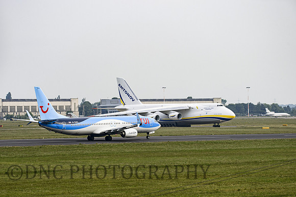 TUi B737-800 G-TAWL passes Antinov 124-100 UR-82073 as it taxis 22.06.2017